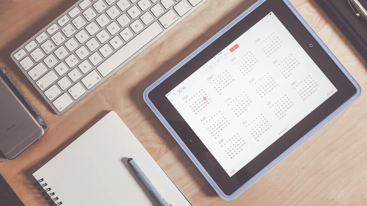 AI appointment booking for local businesses — The Complete Guide tablet with a calendar view on a desk