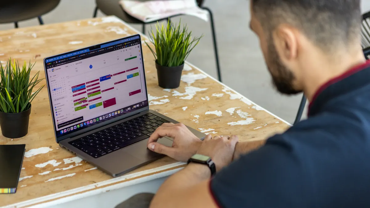 AI appointment booking for local businesses — The Complete Guide person using a laptop calendar scheduler
