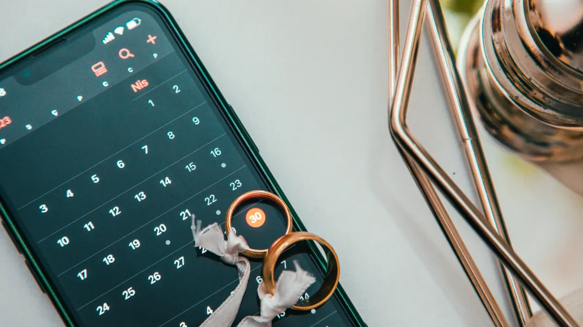 Calendar app on a smartphone beside keys