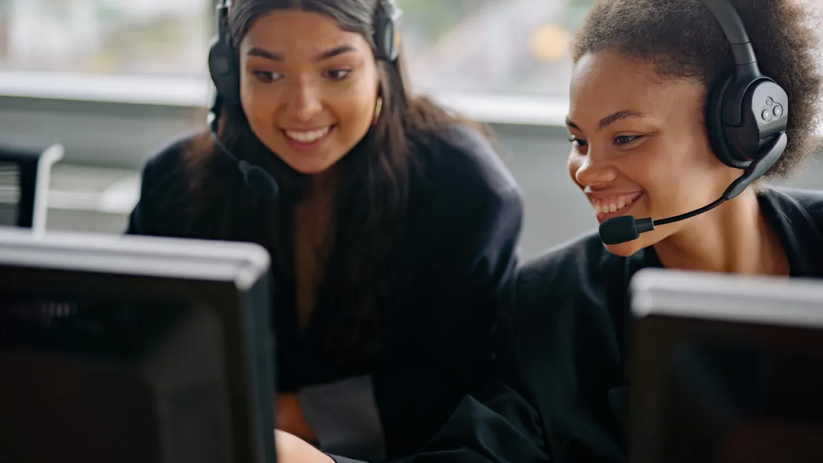AI chatbot pricing: what website owners should budget for two women at computers wearing headsets